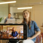 A tradie business staff using a smartphone to perform a live recording